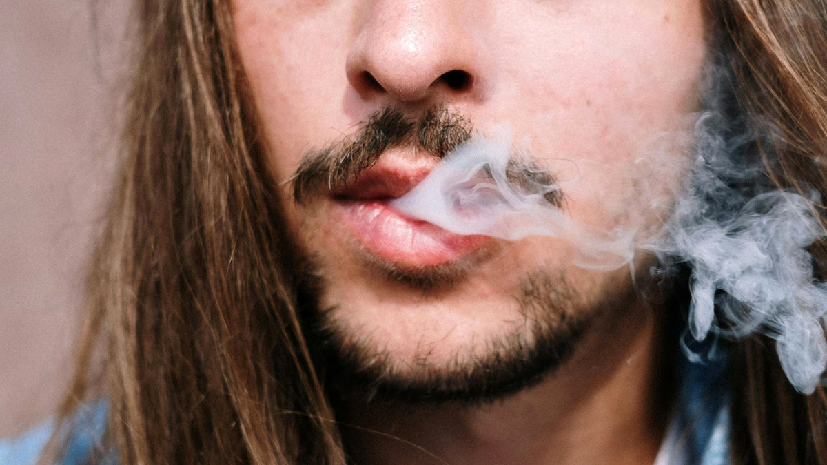 Man Smoking Nine Realms Pre-Roll