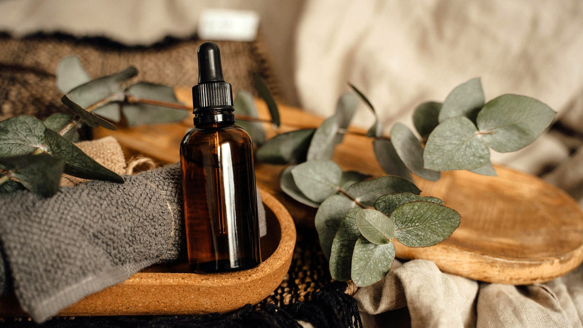 Nine Realms CBG oil bottle sitting on a wooden cartridge in the living room