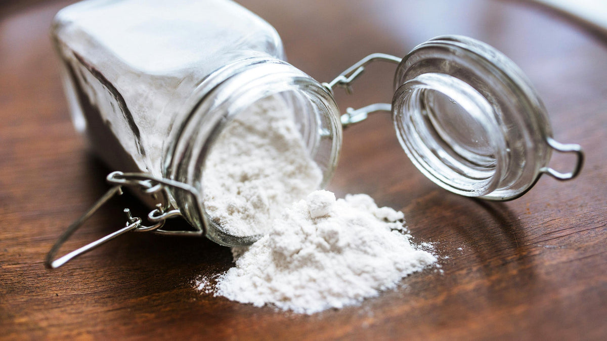 Nine Realms CBN isolate powder laying on the table in a jar