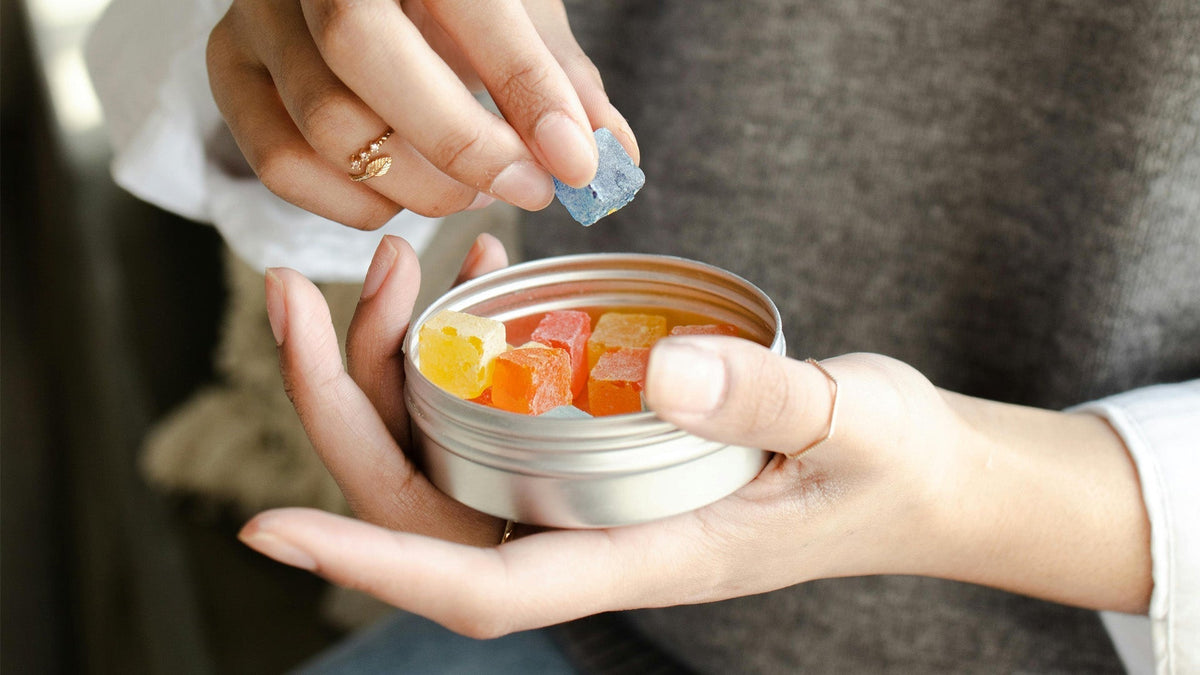 Woman Eating Nine Realms Cannabis Gummies