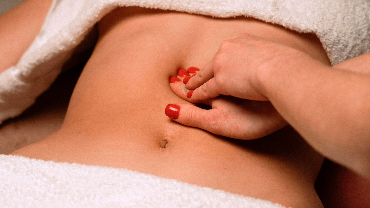 Nine Realms customer getting a massage for gut health