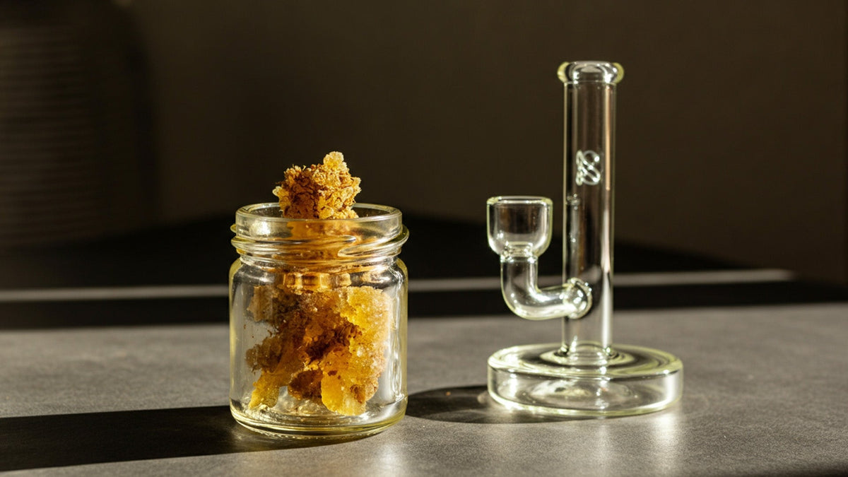 a glass jar full of nine realms live resin on the table