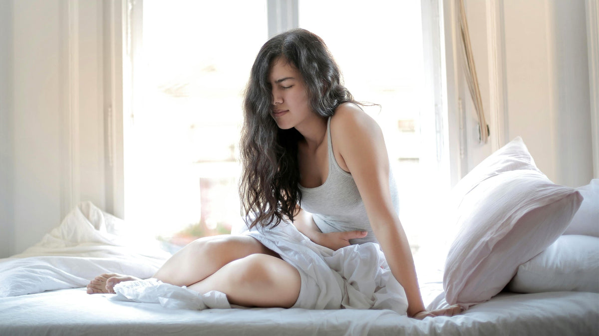 Woman With Stomach Ache After Eating Too Many Nine Realms Gummies