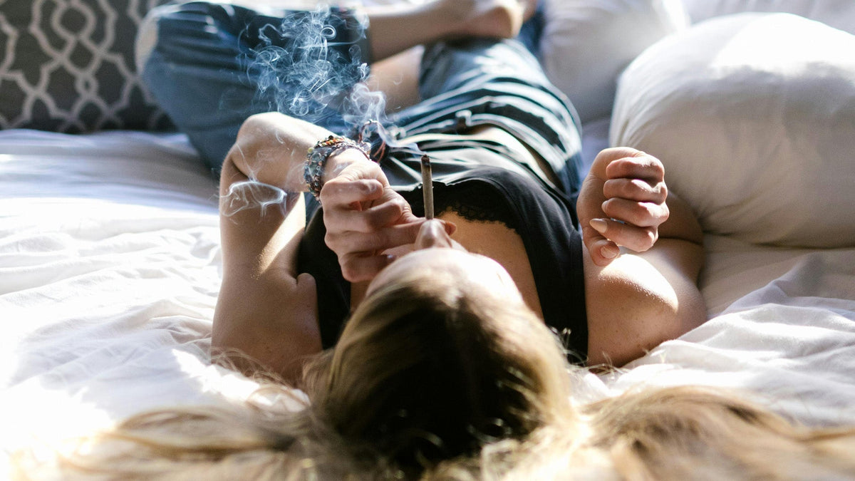 Woman Smoking Nine Realms THC Pre-Roll
