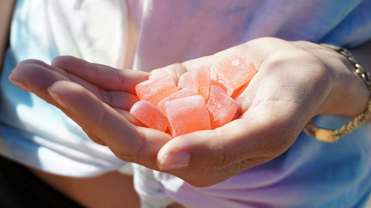 Woman Holding Nine Realms Cannabis Gummies