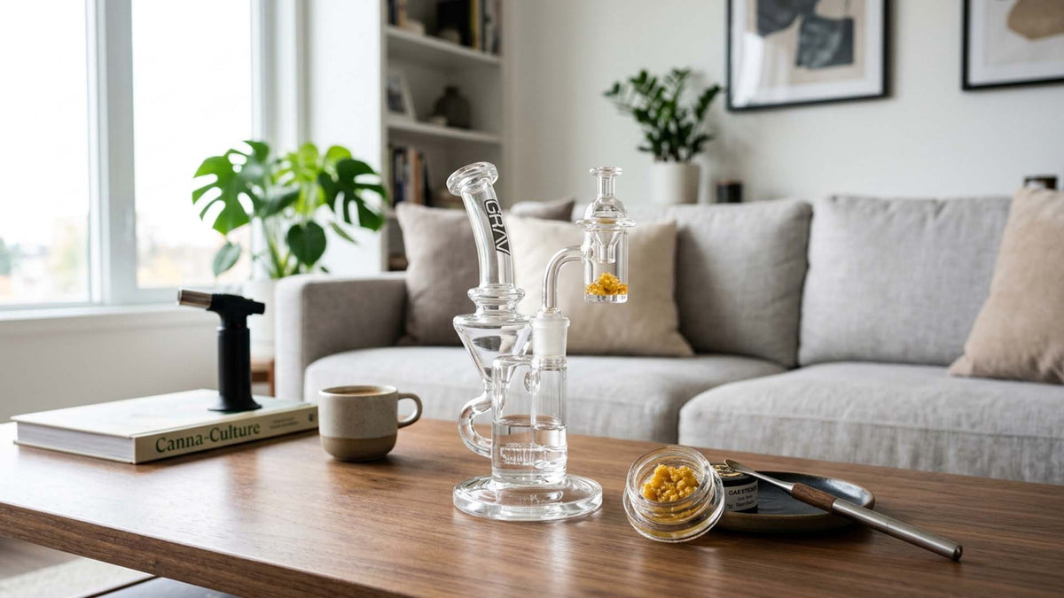 Nine Realms cannabis dab extract on a wooden table next to a glass dab rig