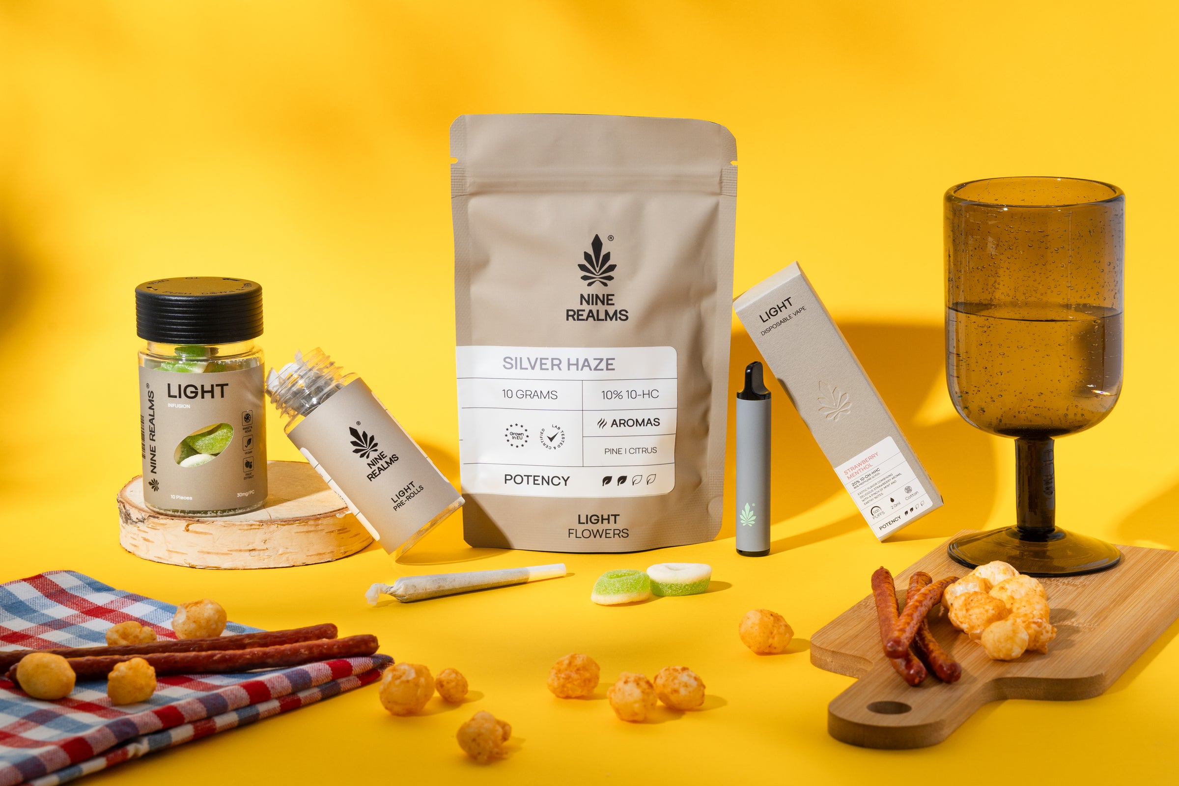 nine realms light cannabis product bundle with cheese and sausages next to it