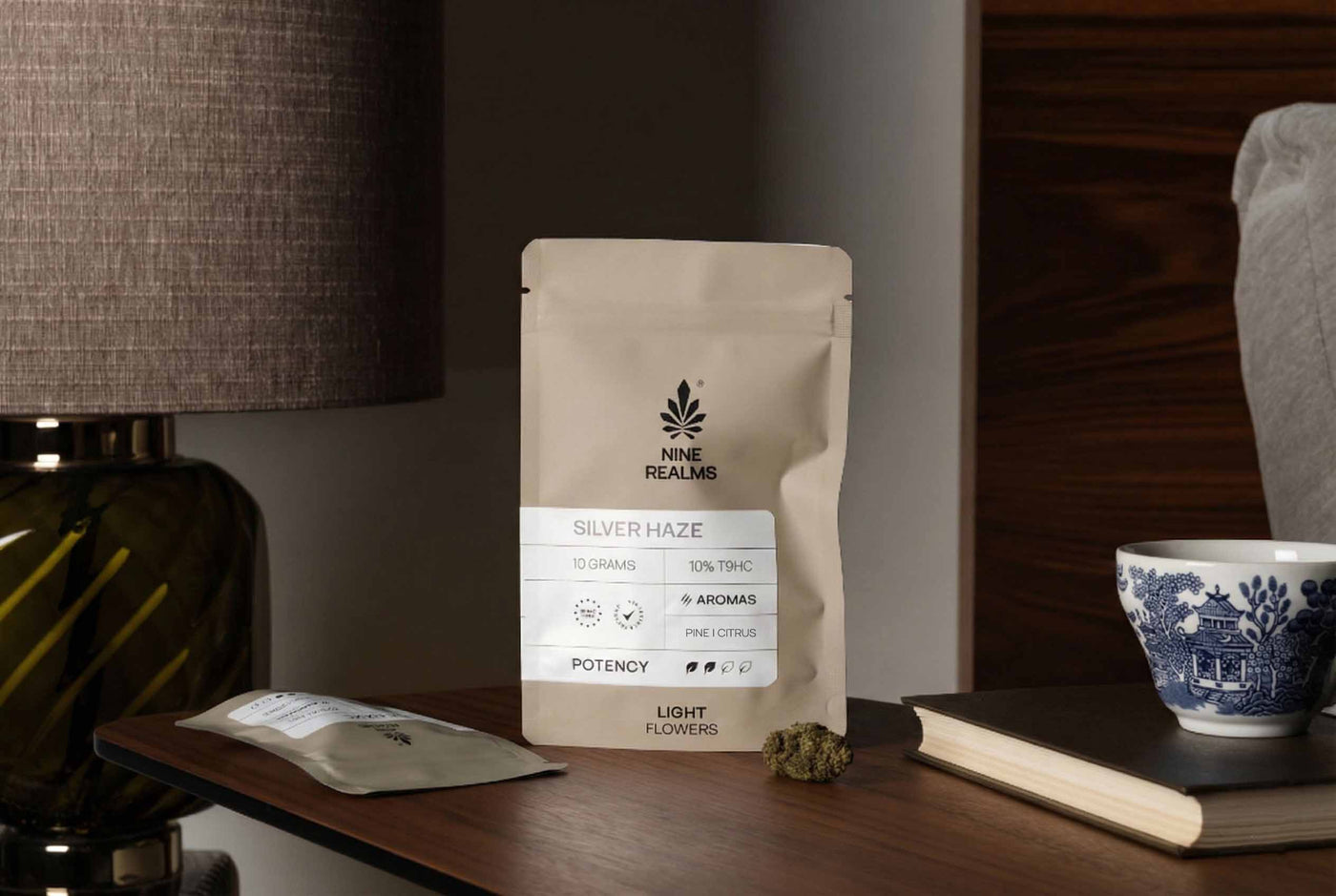 Nine Realms SIlver Haze T9HC Flower and bud on a nightstand.