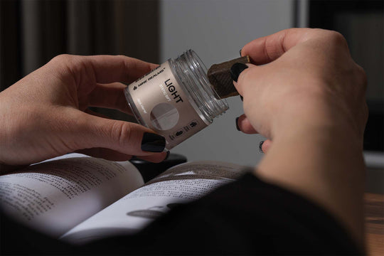 Nine Realms T9HC Static Sift Hash on top of a book