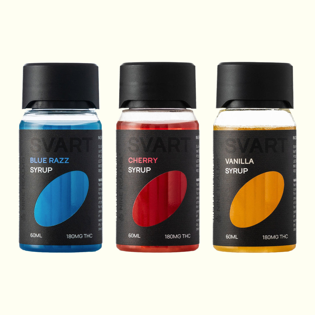 Nine Realms SVART THC Syrup Trio: Blue Razz, Cherry and Vanilla 60 ml bottles side by side on an off-white background